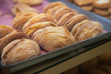 Traditional sweets stand with empanadas, cocadas, mamones in the Oaxaca food market.