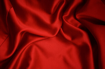 Obraz premium Beautiful red soft silk fabric. Texture, background, pattern. Red silk fabric texture.