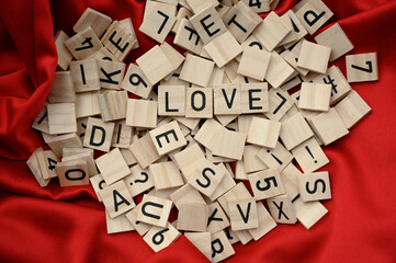 Word LOVE from wooden cubic letters. Valentine's Day composition