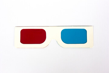 Aerial view of retro white 3d glasses with blue and red plastic on white background