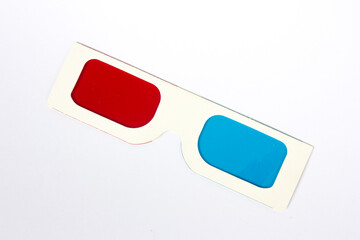 Aerial view of retro white 3d glasses with blue and red plastic on white background