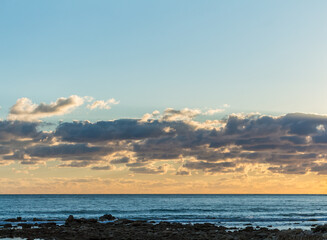 Sunset at Cyprus Beach: Pastel Colors, Clouds over the Sea, Rocky Cliff