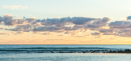 Sunset at Cyprus Beach: Pastel Colors, Clouds over the Sea, Rocky Cliff