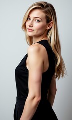 Fototapeta premium Elegant Blonde Woman in Black Dress Studio Portrait Shoulder and Back View