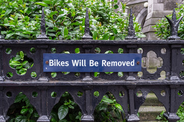 Bikes Will Be Removed Sign on railings