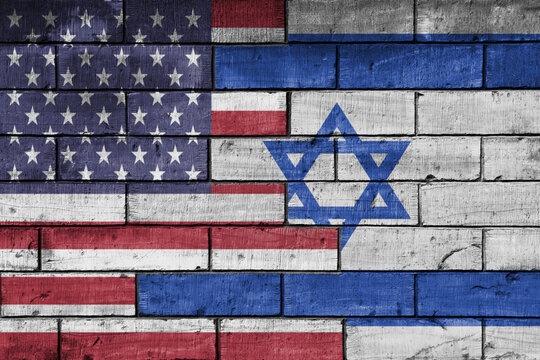 colourful painted big flag of united states of america and flag of israel on a massive old brick wall background. concept