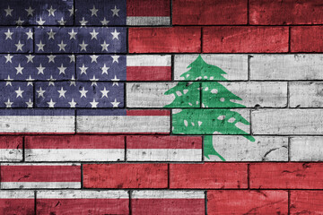 colourful painted big flag of united states of america and flag of lebanon on a massive old brick...
