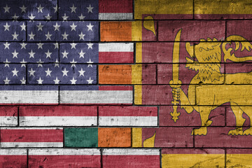 colourful painted big flag of united states of america and flag of sri lanka on a massive old brick...