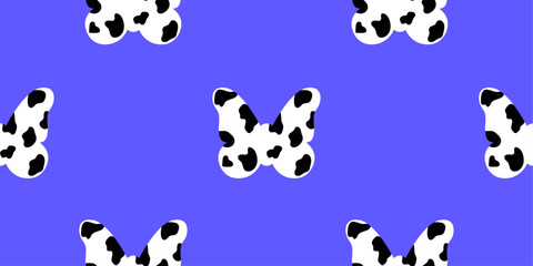 Fototapeta premium Butterfly symbol with dalmatian, cow print on bright blue background for textile, decorative wrapping paper, fabric. Seamless animal design pattern.