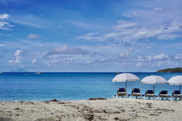 The horizon dotted with ships is your view from Great Bay Beach with St. Barths visible in the distance.