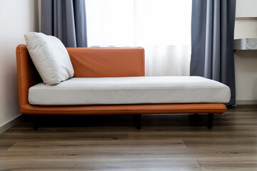 A sofa in the corner of the room