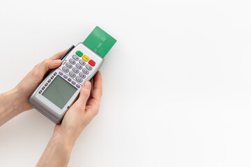Female holding in hands bank payment terminal for contactless payment by credit cards, top view