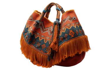 Colorful handwoven bag with intricate designs and fringe detailing displayed on a light background