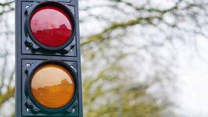 A construction zone with active roadwork and traffic lights regulating the flow.