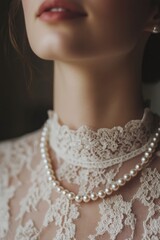 Closeup of a woman wearing a pearl necklace and lace dress