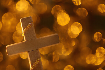 Orange Bokeh Effect with Crucifix in Focus on the Left