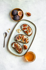 Fig sandwiches with cheese and honey for breakfast. Top view