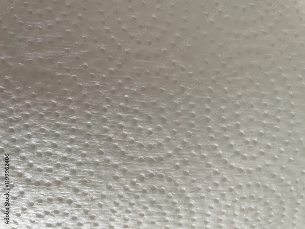 Poster surface pattern of textured material viewed closely during daylight hours, showcasing fine details. 