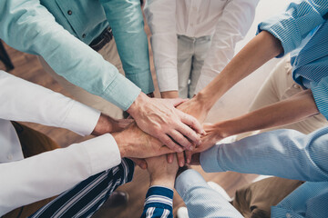 Cropped photo of teamwork startup partners hold hands circle support comfortable nice creative...