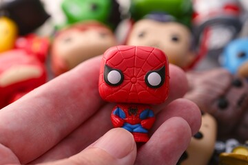 Naklejka premium Tambov, Russian Federation - August 23, 2024 Spider-Man Funko POP Mini Vinyl Figure in person hand.