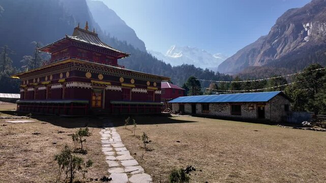 Manaslu, Nepal: Point of view of a trekker walking toward the Hinang monastery with the Himal Chuli mountain along the Manaslu circuit in the Himalaya in Nepal. 