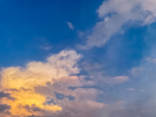 Beautiful sky with natural gradations. Thick clouds in the dusk sky on a winter night. Image of a cloudy sky in the afternoon. View of the night sky with golden light from the evening sun