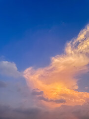 Beautiful sky with natural gradations. Thick clouds in the dusk sky on a winter night. Image of a cloudy sky in the afternoon. View of the night sky with golden light from the evening sun