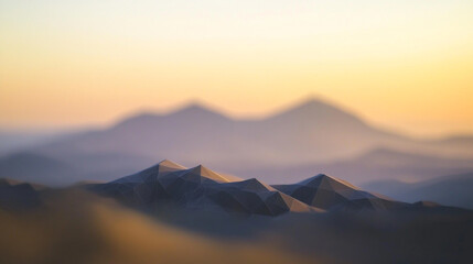Majestic mountain landscape at dawn with soft focus and warm colors in the sky