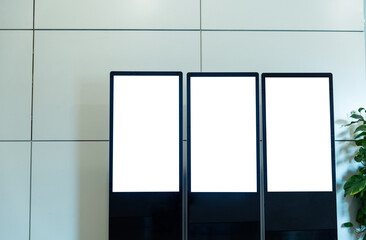 Three touch display kiosks in a row at  airport