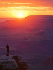 Obraz premium Traveler admires breathtaking sunset over vast canyon landscape at dusk. Generative AI