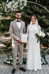 wedding ceremony of the newlyweds on the glade