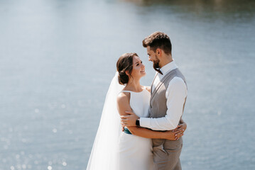 bride blonde girl and groom near the river