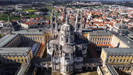 Gordijnen landmarks of Portugal and famous places. Mafra National Palace, barocco style architecture. Unesco heritage site. High angle drone aerial view © Freesurf