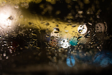 Raindrops on the glass in the evening