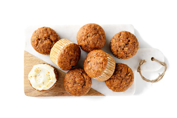 Homemade Carrot Muffins with Cream Cheese Frosting for every day. isolated on white background, top view