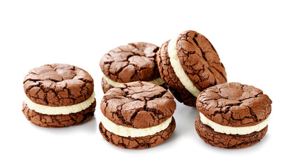 Chocolate sandwich cookies, brownie biscuits with  cream cheese filling isolated on white background
