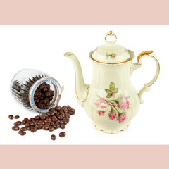 Elegant vintage porcelain coffee pot and roasted coffee beans isolated on white background.