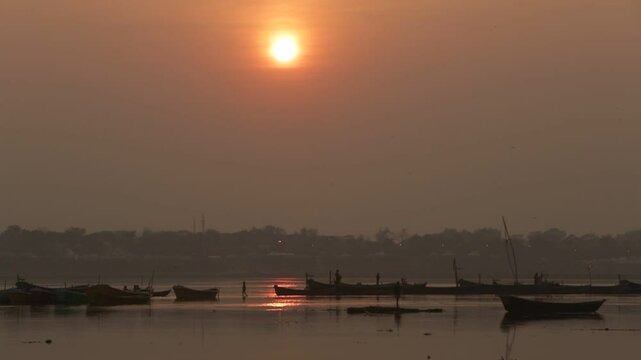 Sunset over the river in Maha Kumbh Mela, Allahabad, India