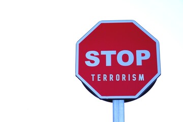stop terrorism. letters written on a stop sign