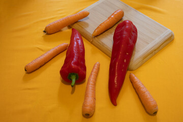 A selection of vegetables on a yellow surface