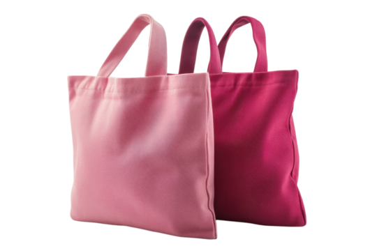 Colorful tote bags in varying shades of pink on display at a local market for stylish shopping