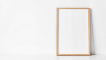 Minimalist frame with blank canvas on white wall, creative potential