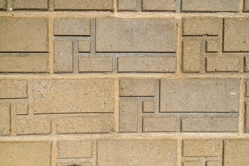 Close-up of a concrete pattern on a building wall.