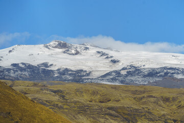 Snow-covered Eyjafjallajökull glacier with visible black ash layers from the 2010 volcanic eruption, Iceland