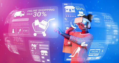 Happy teenager wearing VR glasses and looking online shopping screen. Smart african girl using...