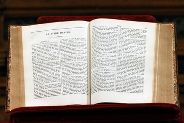Fototapeta premium Old bible open in a church. The book of Esther. Paris. France.