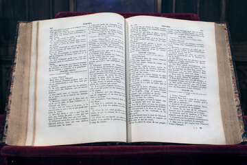 Obraz premium Old bible open in a church. The psalms. Paris. France.