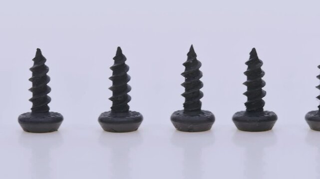 Metal screws for fastening equipment. Soft focus. Close-up. 