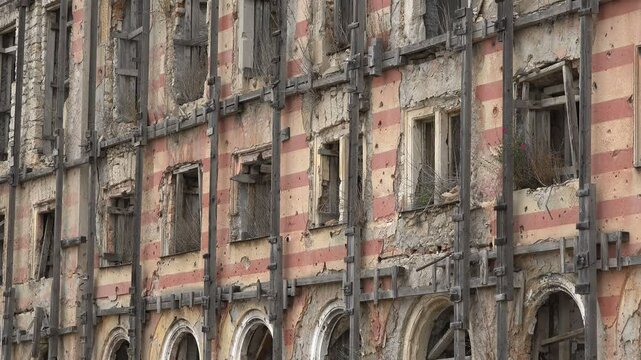 Bullet holes in remains of the Tito Palace building in Mostar remind of the tragic Bosnian war 
