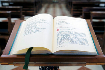 Open bible in a catholic church. Sacred text.  Treviso. Italy.